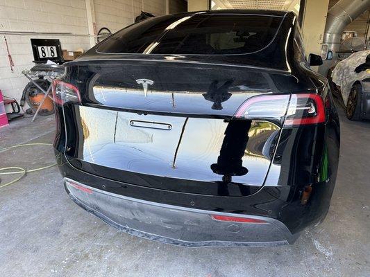 Tesla Model Y in for bumper and lower liftgate repairs