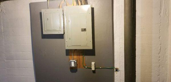 Newly installed panels with service receptacle and secondary ground and communition grounding bar for cable company.