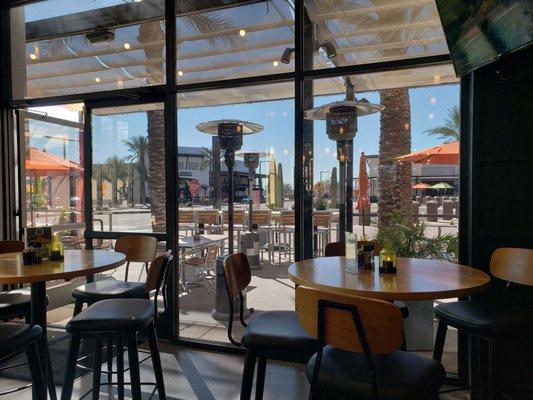 Outdoor patio with heaters.