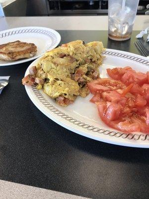 Fiesta omelette that feel a part  Still good . Tomato's. Chicken breast