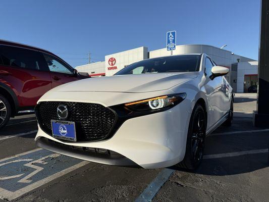 White Mazda 3 Premium Hatchback on display in Putnam Mazda