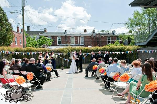 Our wedding in the back courtyard of the Visual Arts Center