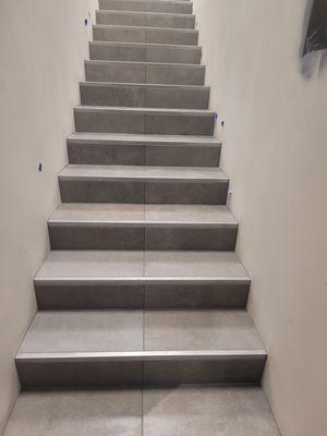 Porcelain Tile and metal nosing on stairs at Genesis Dealership in Santa Monica