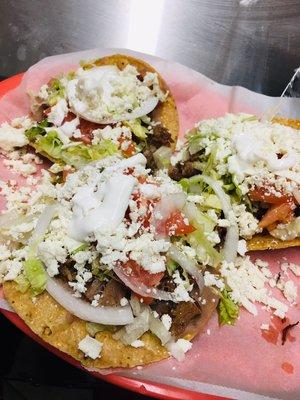 Happy Monday  Come try our delicious beef tongue tostadas topped off with beans, lettuce, tomato, onion, cheese & sour cream