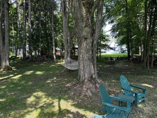 Mediation chairs along a peaceful creek, hammock, and chairs to relax or read a book!