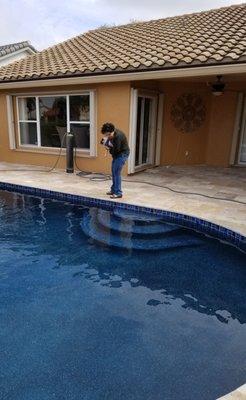 Water filter in the background, looking at the newly filled pool