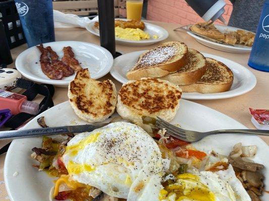 Bacon, waffles, French toast, eggs, veggie lover's mess