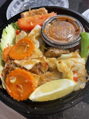 Pad Woon Sen with pork - clear glass noodles underneath all of those fresh veggies, and tons of meat! We ordered ours extra spicy