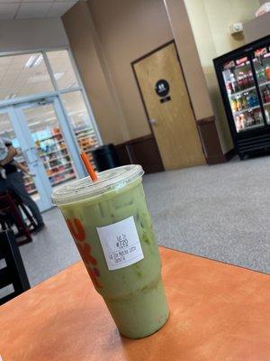 large iced matcha latte with oat milk