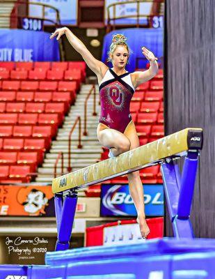 OU Gymnast practicing on the balance beam before competing in Oklahoma City.