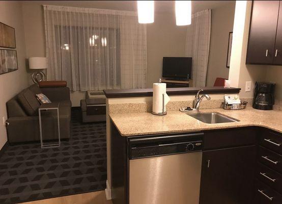 View of the living room/sitting area from kitchen (which also has a dishwasher as this photo shows!)