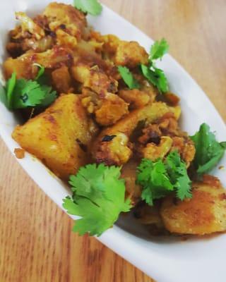 Aloo Gobi - cauliflower and potatoes stir fried in garam masala and other spices