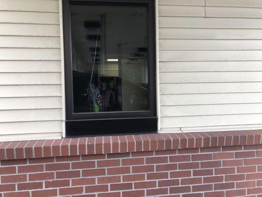 Friday, May 31, 2019: drive-thru window of former credit union. Now the area is just employee parking.