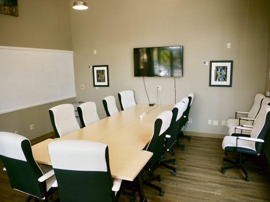 Large conference room - 15 people seated, 20 without tables