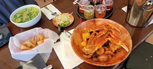 Cajon seafood boil with corn, potatoes, and lobster Garlic parmesan shrimp  Veggies noodle pho