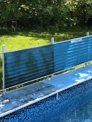 Pressure washed pool deck before and after