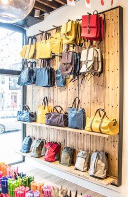 Reclaimed boxcar boards repurposed as retail display shelves.