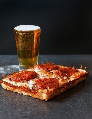 Sausage Supreme Pizza and a pint of beer