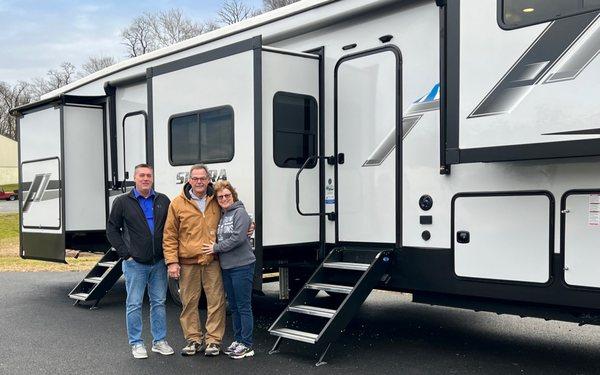 Happy new owners of this beautiful RV.