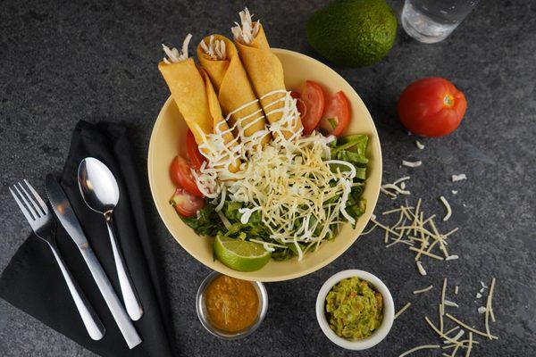 Chicken Flautas, with guac, salsa, sour cream and queso fresco.