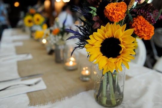 Flowers at the Head Table from our June wedding. Photo by Custom Creations