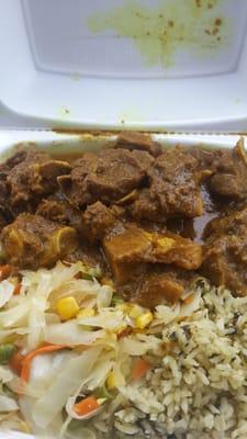 medium curry goat (extra) spinach rice $10 @ Silver Krust