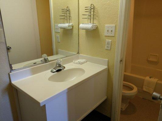 There's more counter space for your toiletries in the regular room.