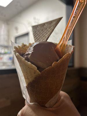 Dark chocolate ice cream on a waffle cone