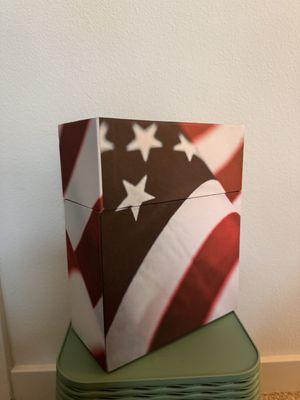 Cardboard box with flag on it