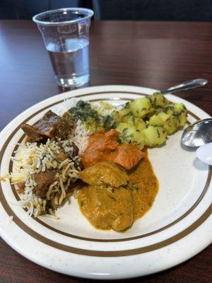 Chicken biryani, goat curry, daal, spiced potatoes, butter chicken, fish curry. Delicious!