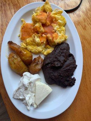 Classic breakfast plate -- eggs, plantains (very good), cheese, and refried beans