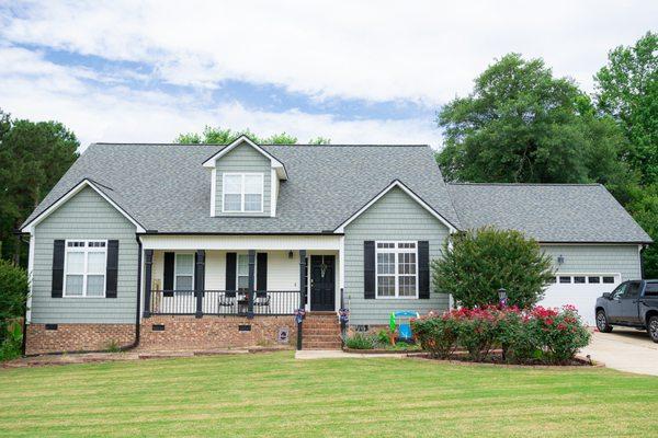 Complete transformation! The Odyssey team upgraded the roofing, siding, gutters, AND windows of this home!