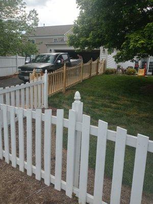 4FT TALL DIP TOP PICKET. 1X4 BOARDS WITH GOTHIC POSTS. FENCE PAINTED WHITE BY HOMEOWNER.