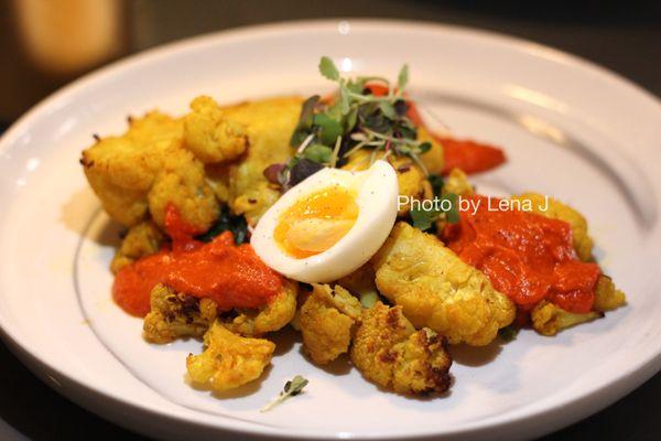 Roasted Cauliflower ($30) - wilted greens, poached egg, olive, tomato, almond romesco