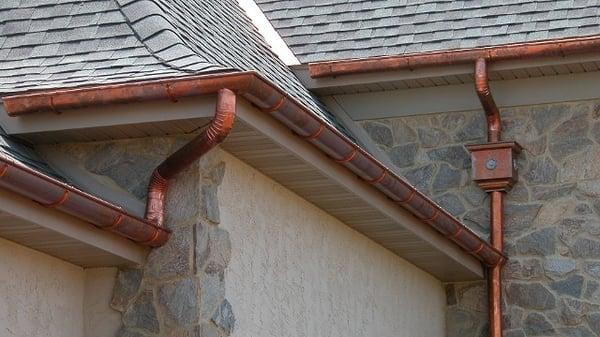 Installed new 50 year shingled roof and copper gutters