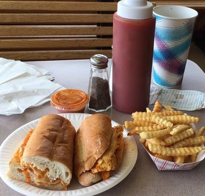 Buffalo chicken cheesesteak, best fries around and a fountain soda.