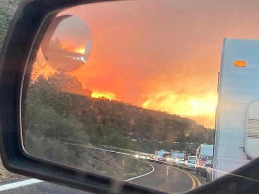 Picture from side mirror of fire encroaching on Pine