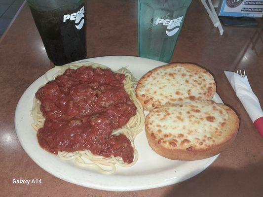 Spaghetti with meat sauce and cheese-garlic bread.