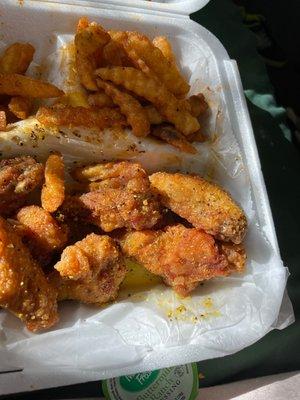 Lemon pepper wings in Kasian fries! Highly recommend! Best Kasian fries I've ever had in my life!