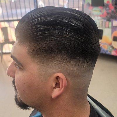 SIMPLE SLICK BACK WITH A MEDIAM SKIN FADE.