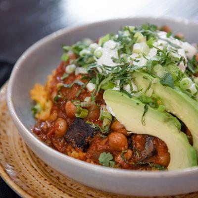 Vegetarian Chili with Yellow Rice and Avocado.