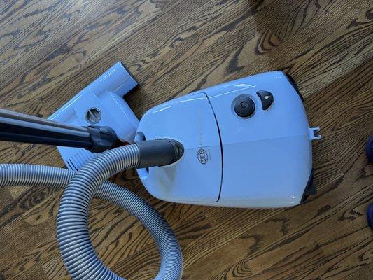 SEBO baby blue canister vacuum