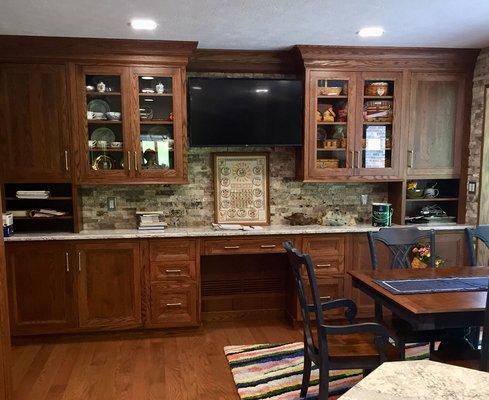 Oak cabinetry office area.