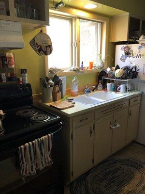 Well stocked Kitchen- plates bowls, plates, silverware- everything to prepare a meal. You cook, and wash up. Frig, cubbies, microwave.