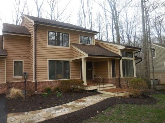 Earth tones work great on this home, blending the landscaping elements and surrounding natural foliage into a unique and inviting atmosphere