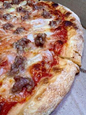 Nice crust close up on a Medium sausage and onion pizza - great crust, crispy, chewy and a bit soft in the middle