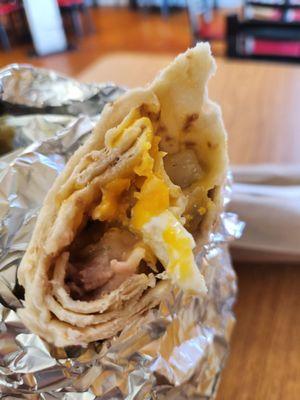 Huevos Rancheros burrito with runny eggs