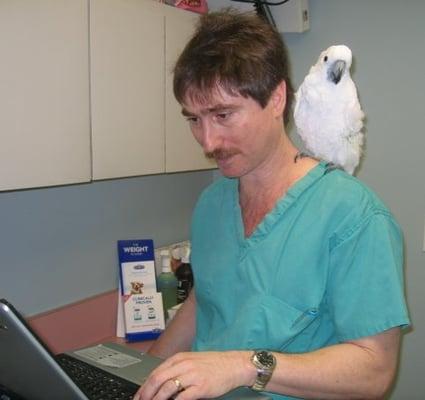 Dr. Davidson and friend view an electronic medical record.