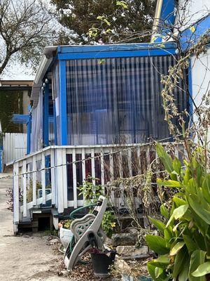 The popular outdoor seating is protected from the weather.