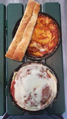 Beef Ravioli (top), Eggplant Parmesan (bottom), breadsticks